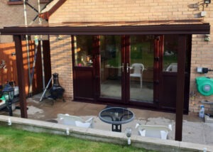 Milwood Group Installation Of Chocolate Brown Veranda In Wales Installed By Greenspace Living